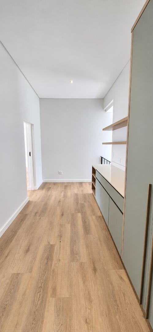 769733_Light-Filled_Minimalist_Hallway_with_Oak_Flooring.png